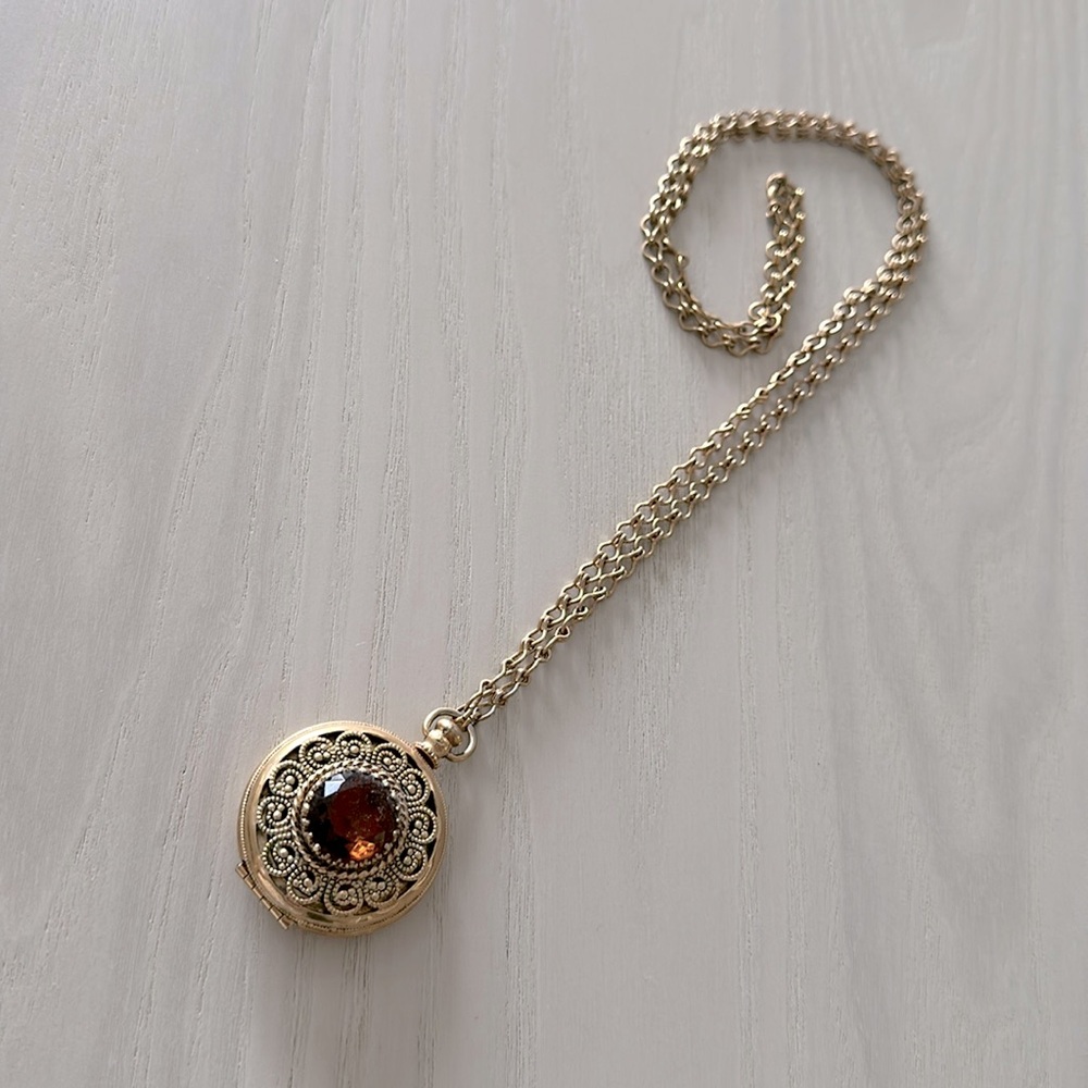 Vintage AVON locket, large “topaz” jewel, normal vintage wear, chain hangs 15”